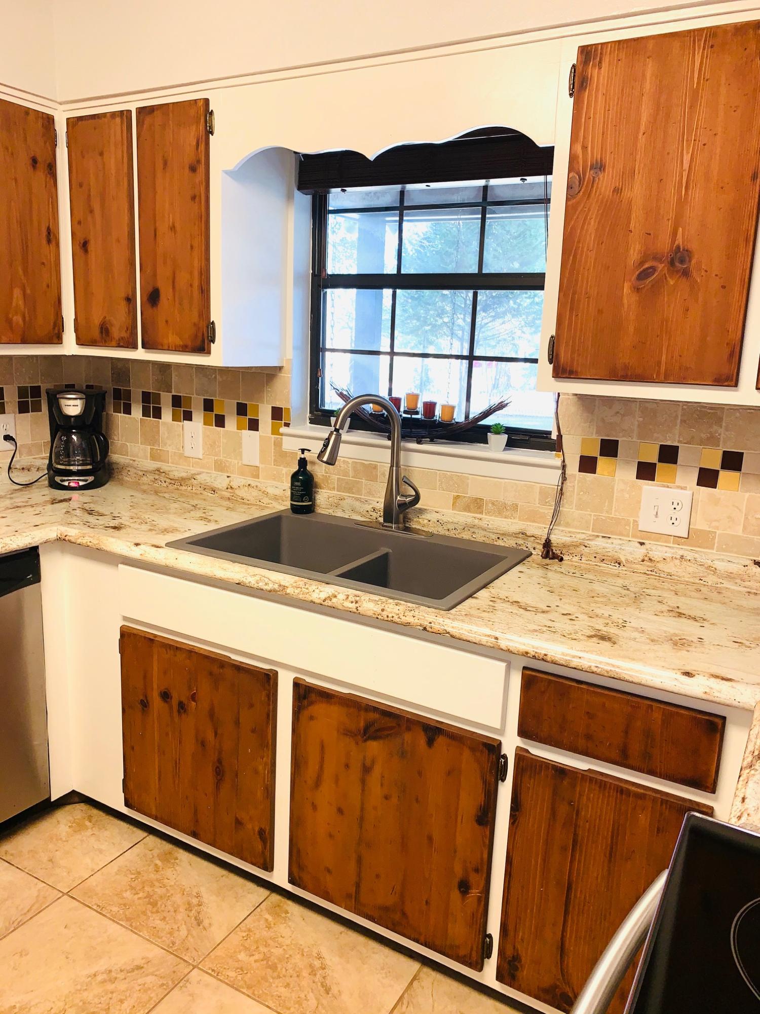 5846 Dairy Road Baker, FL 32531 - Photo 19 of 68 a view of a kitchen with a sink and a large window