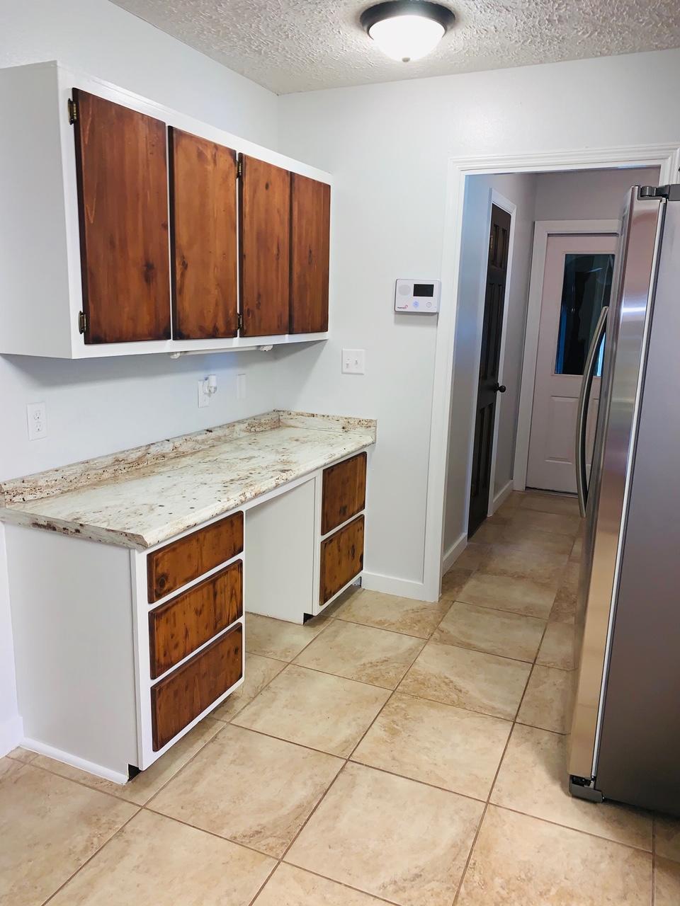 5846 Dairy Road Baker, FL 32531 - Photo 21 of 68 a kitchen with stainless steel appliances granite countertop a stove a sink and a microwave