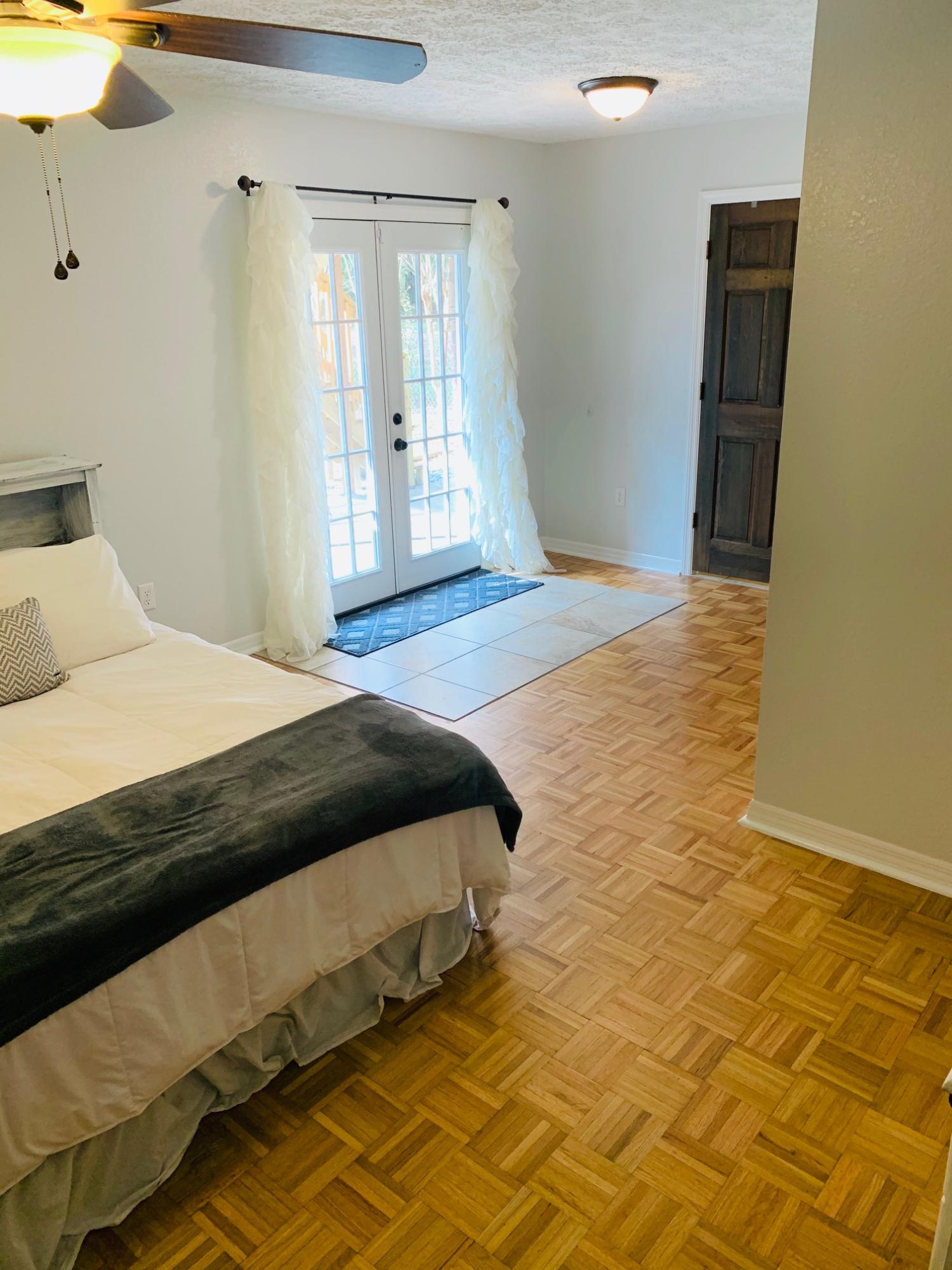 5846 Dairy Road Baker, FL 32531 - Photo 27 of 68 a bedroom with a bed and wooden floor