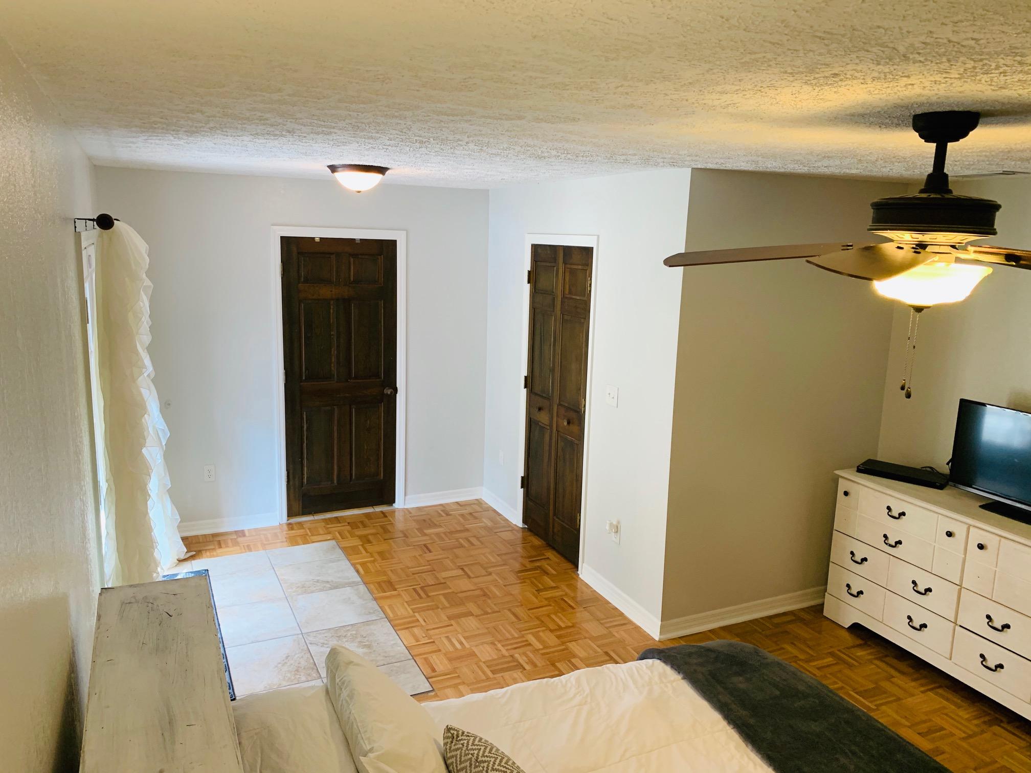 5846 Dairy Road Baker, FL 32531 - Photo 28 of 68 a bedroom with a bed and chandelier