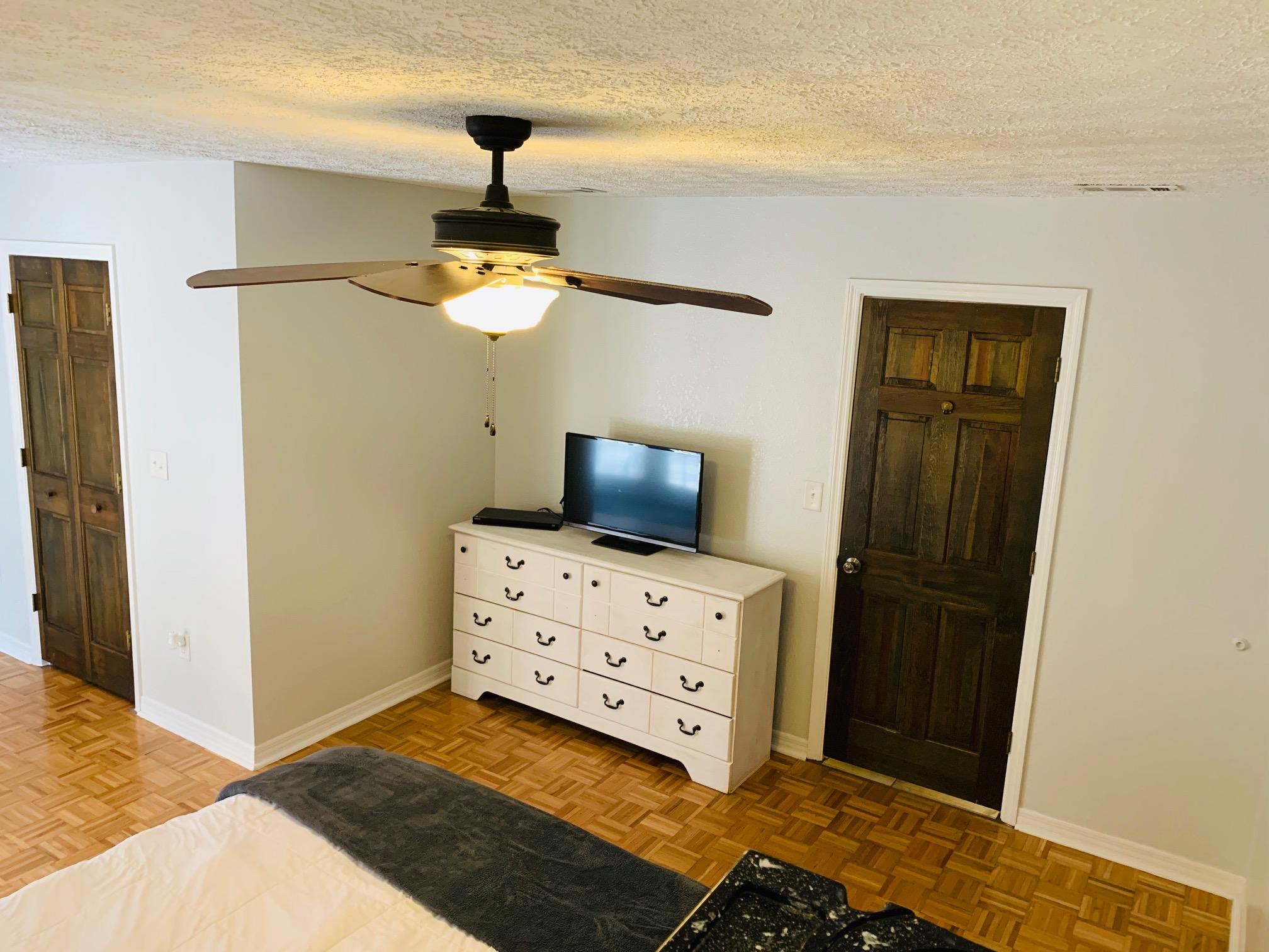 5846 Dairy Road Baker, FL 32531 - Photo 29 of 68 a bedroom with a bed and wooden floor