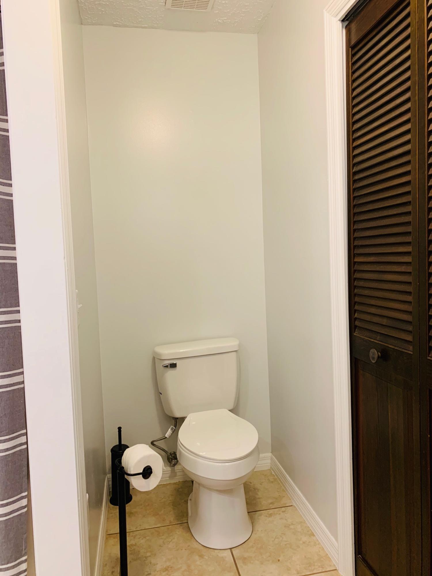 5846 Dairy Road Baker, FL 32531 - Photo 34 of 68 a white toilet sitting next to a white wall