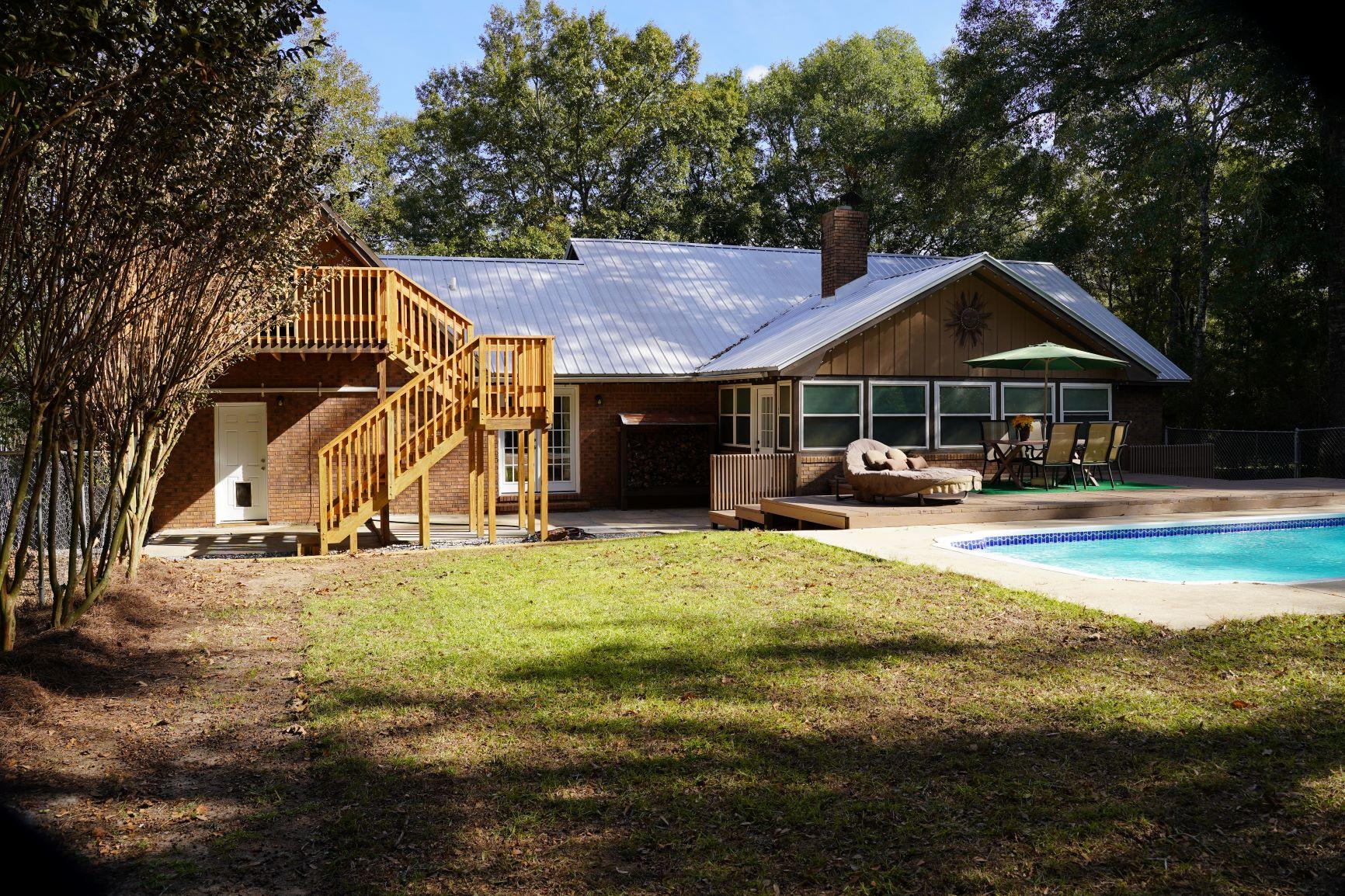 5846 Dairy Road Baker, FL 32531 - Photo 50 of 68 a swimming pool covered with tall trees