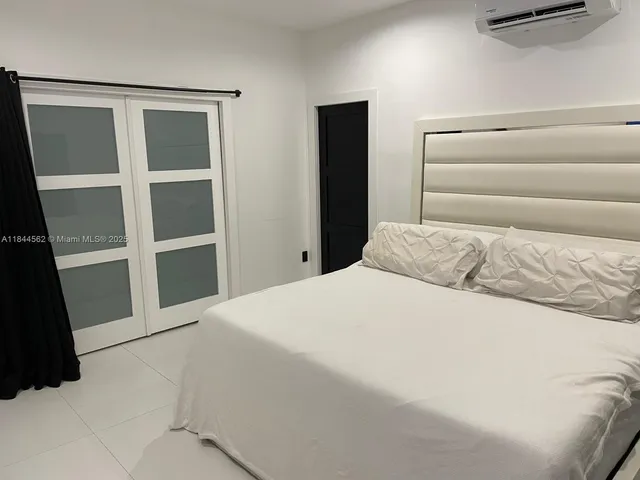 a bathroom with a toilet and a sink