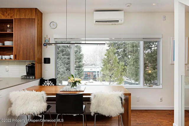a view of a dining room with furniture window and outside view