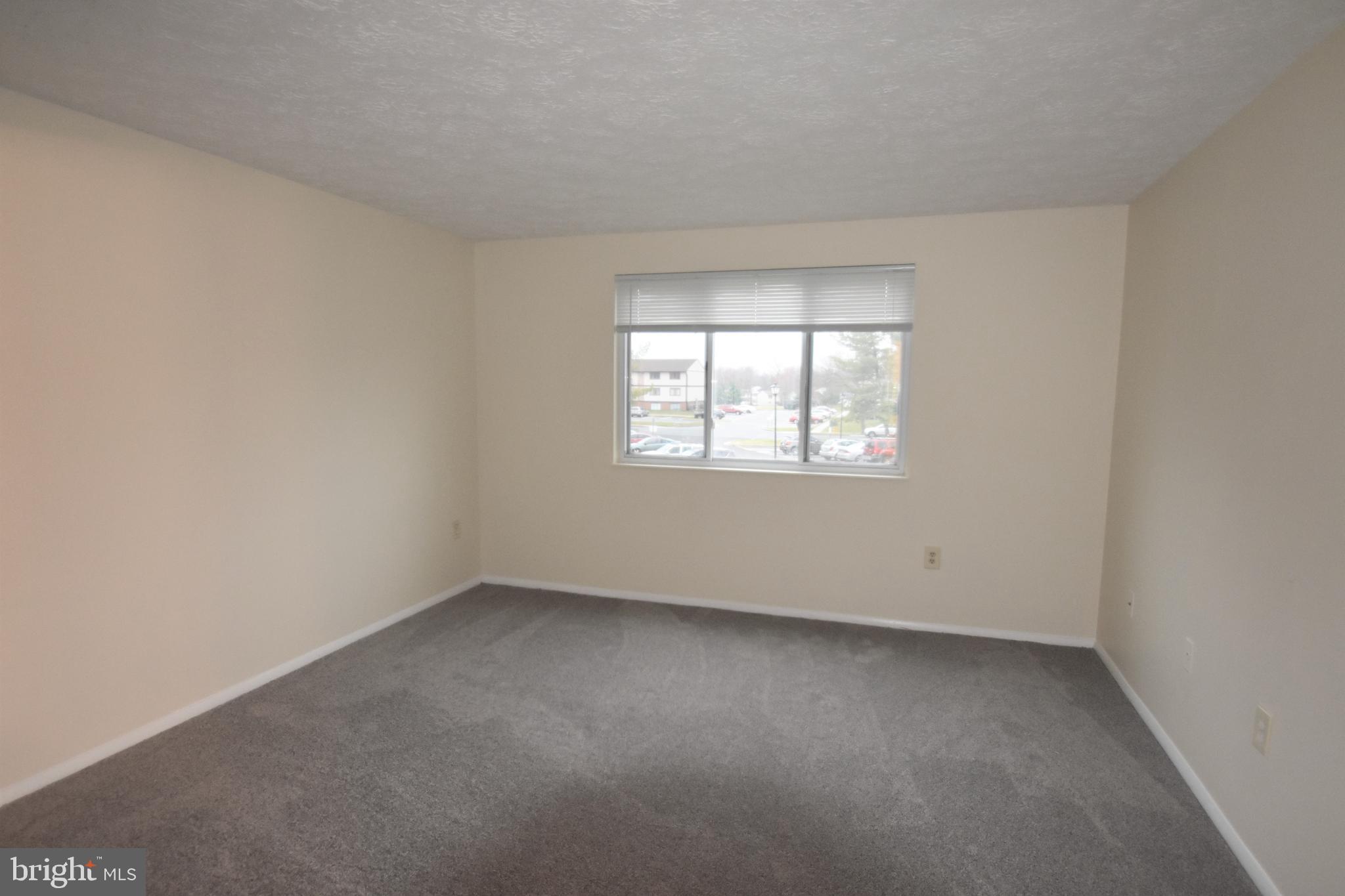 830 Heather Ridge Drive, Unit 22H Frederick, MD 21702 - Photo 8 of 14 an empty room with a window