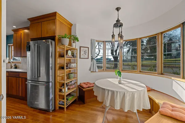 a kitchen with sink refrigerator and window