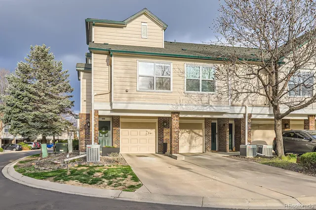 front view of a house with a fountain