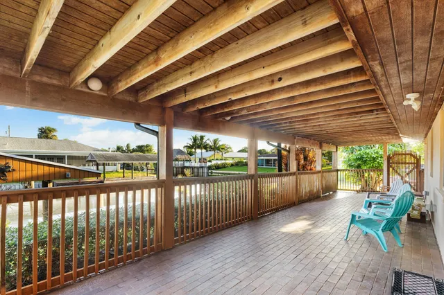a view of a house with a small yard and a garden