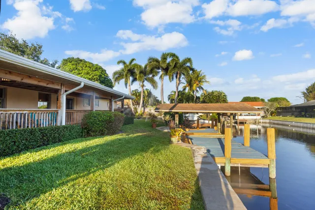 a view of a patio with a table and chairs