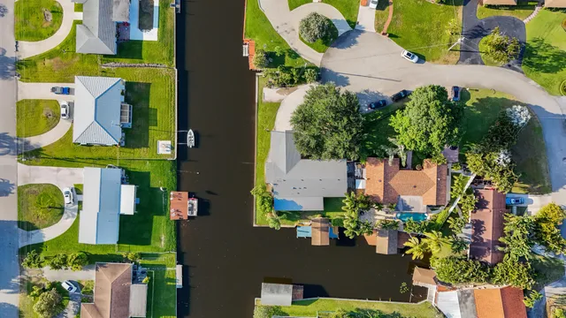 an aerial view of residential houses with outdoor space