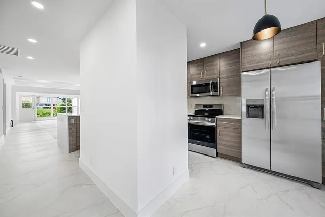 a kitchen that has a sink and a stove
