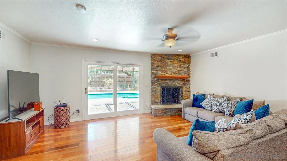 1525 Fair Glen Road El Cajon, CA 92019 - Photo 7 of 15 a living room with furniture fireplace and flat screen tv