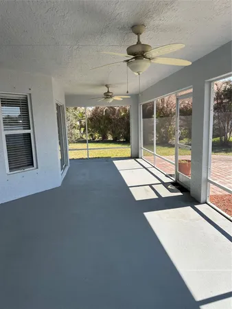 a view of an empty room with a fireplace