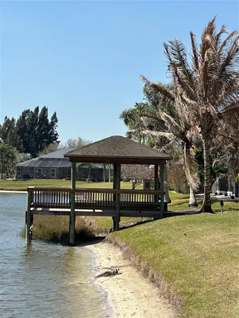 a view of house with a yard