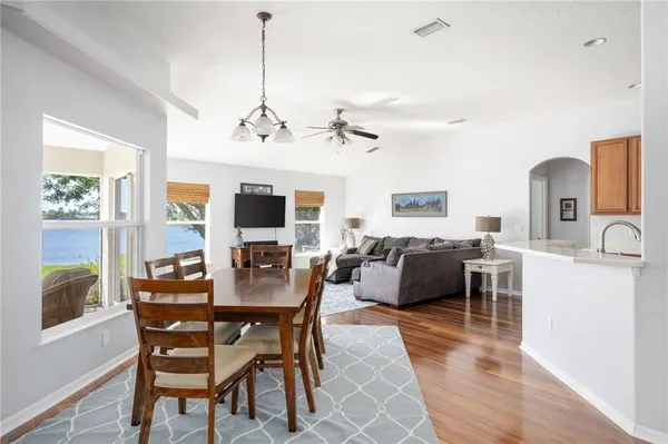 a view of a dining room with furniture window and wooden floor