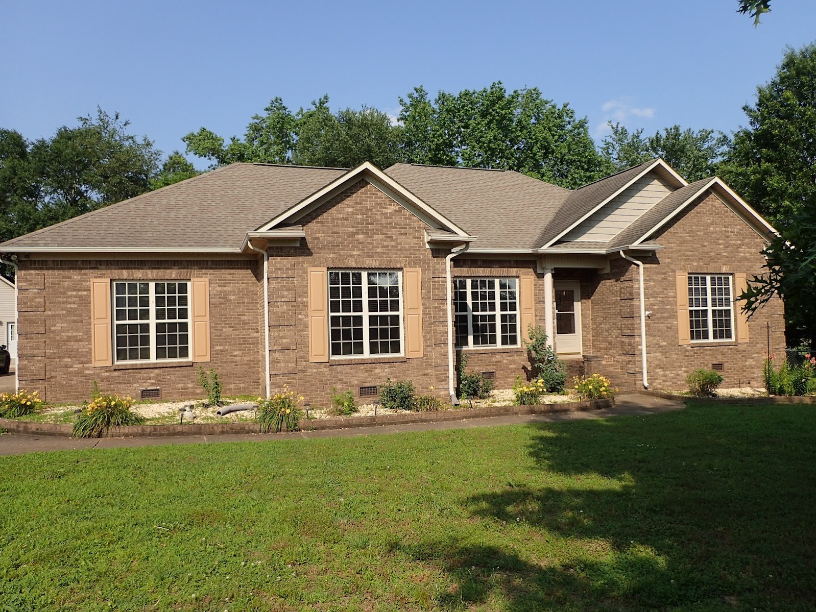 26121 Pheasant Run Ardmore, TN 38449 - Photo 1 of 46 a front view of a house with a yard