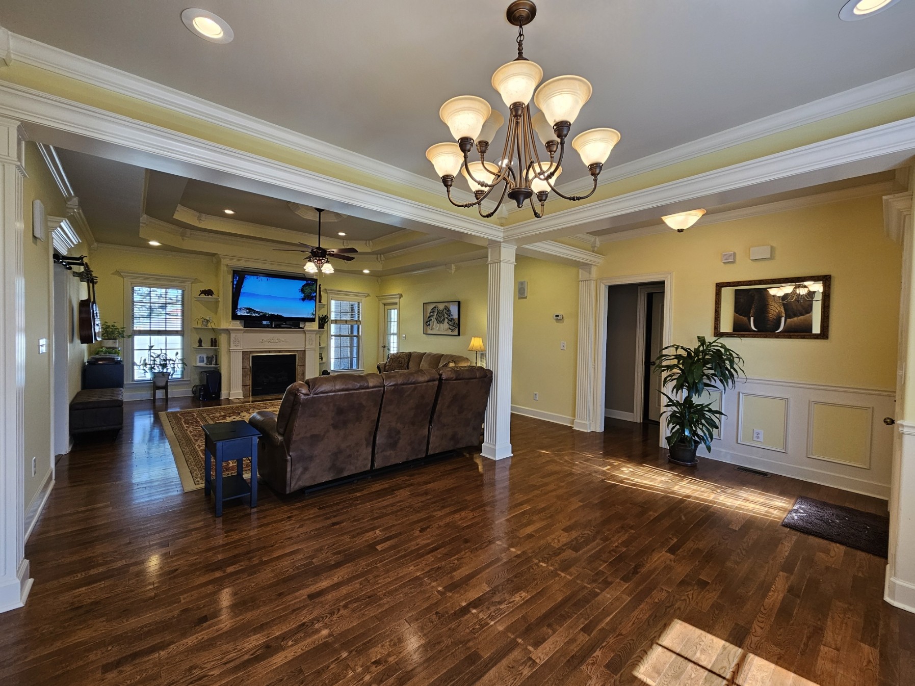 26121 Pheasant Run Ardmore, TN 38449 - Photo 15 of 46 a living room with furniture a fireplace and a chandelier