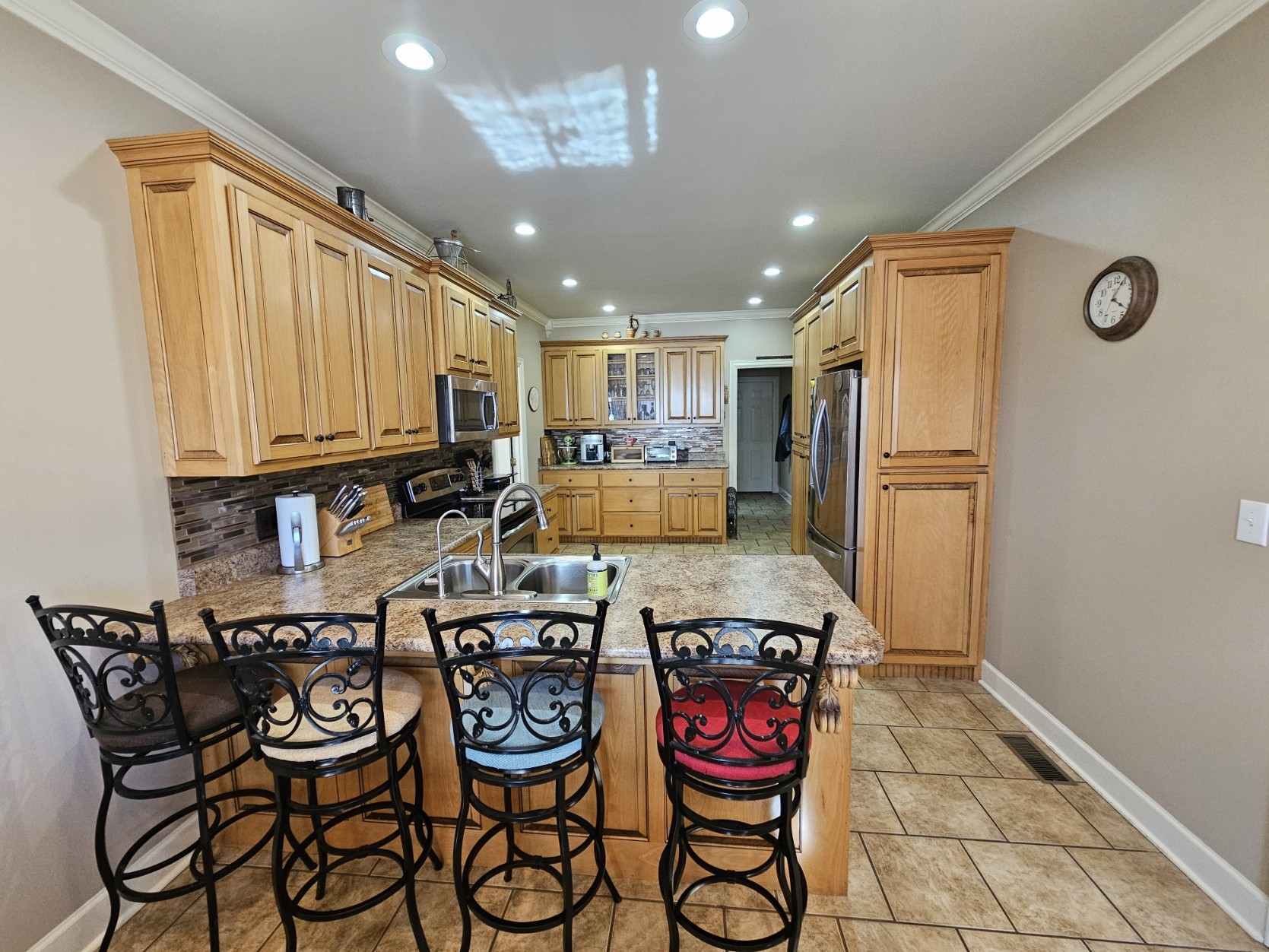 26121 Pheasant Run Ardmore, TN 38449 - Photo 17 of 46 a kitchen with stainless steel appliances granite countertop a refrigerator and microwave