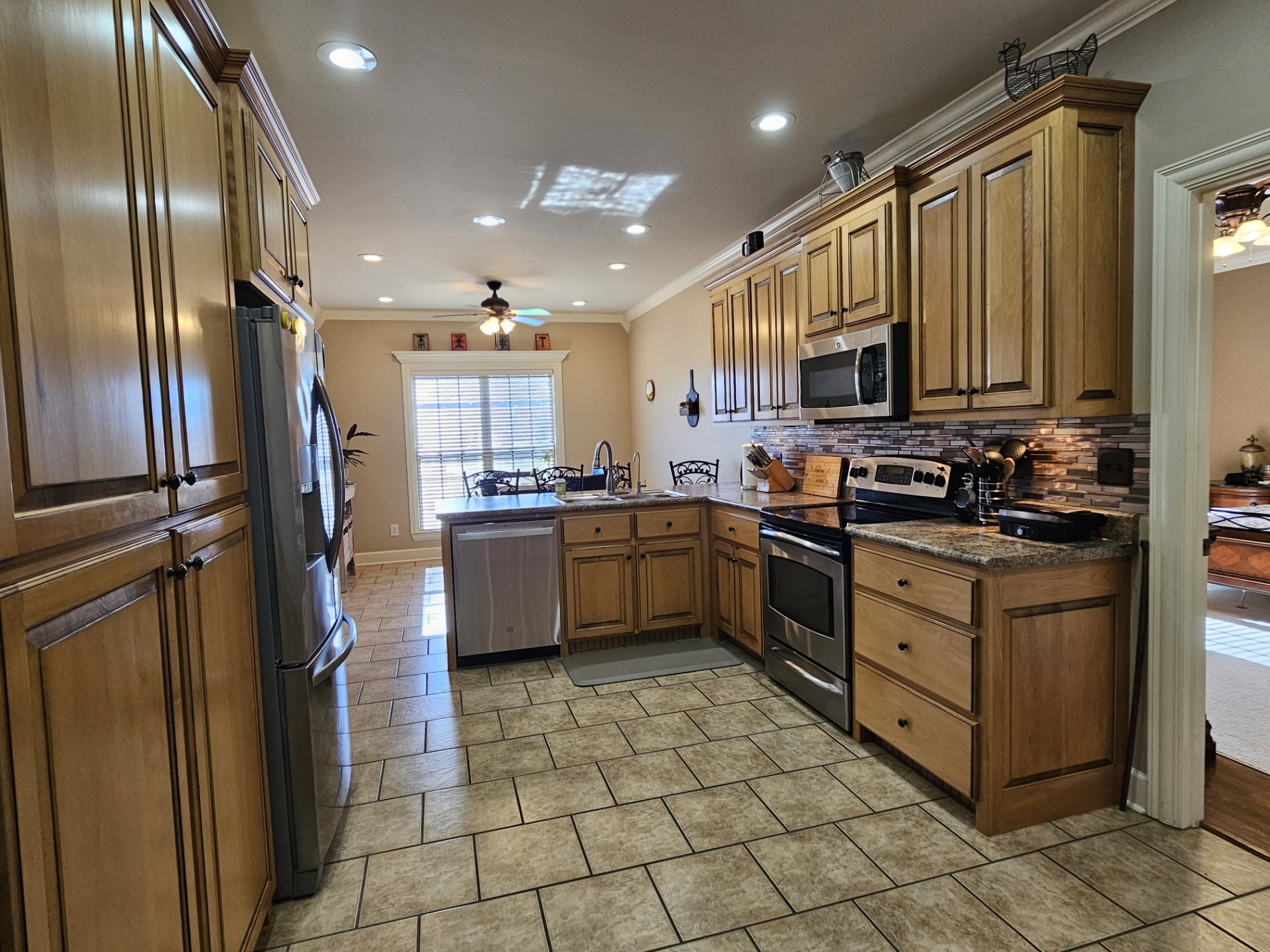 26121 Pheasant Run Ardmore, TN 38449 - Photo 21 of 46 a kitchen with stainless steel appliances a refrigerator sink and cabinets