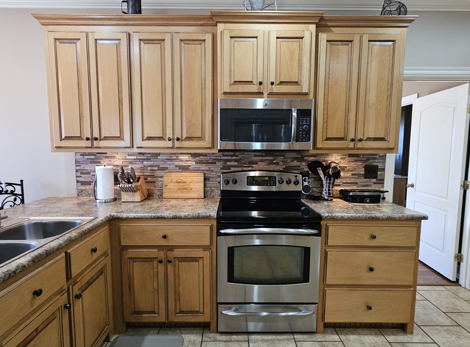 26121 Pheasant Run Ardmore, TN 38449 - Photo 24 of 46 a kitchen with cabinets appliances and a sink