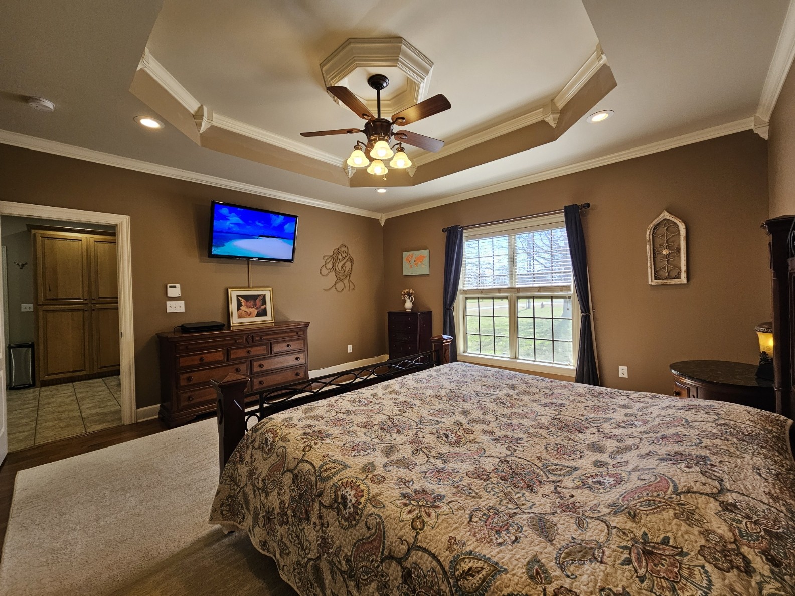 26121 Pheasant Run Ardmore, TN 38449 - Photo 29 of 46 a bedroom with a bed and a flat screen tv