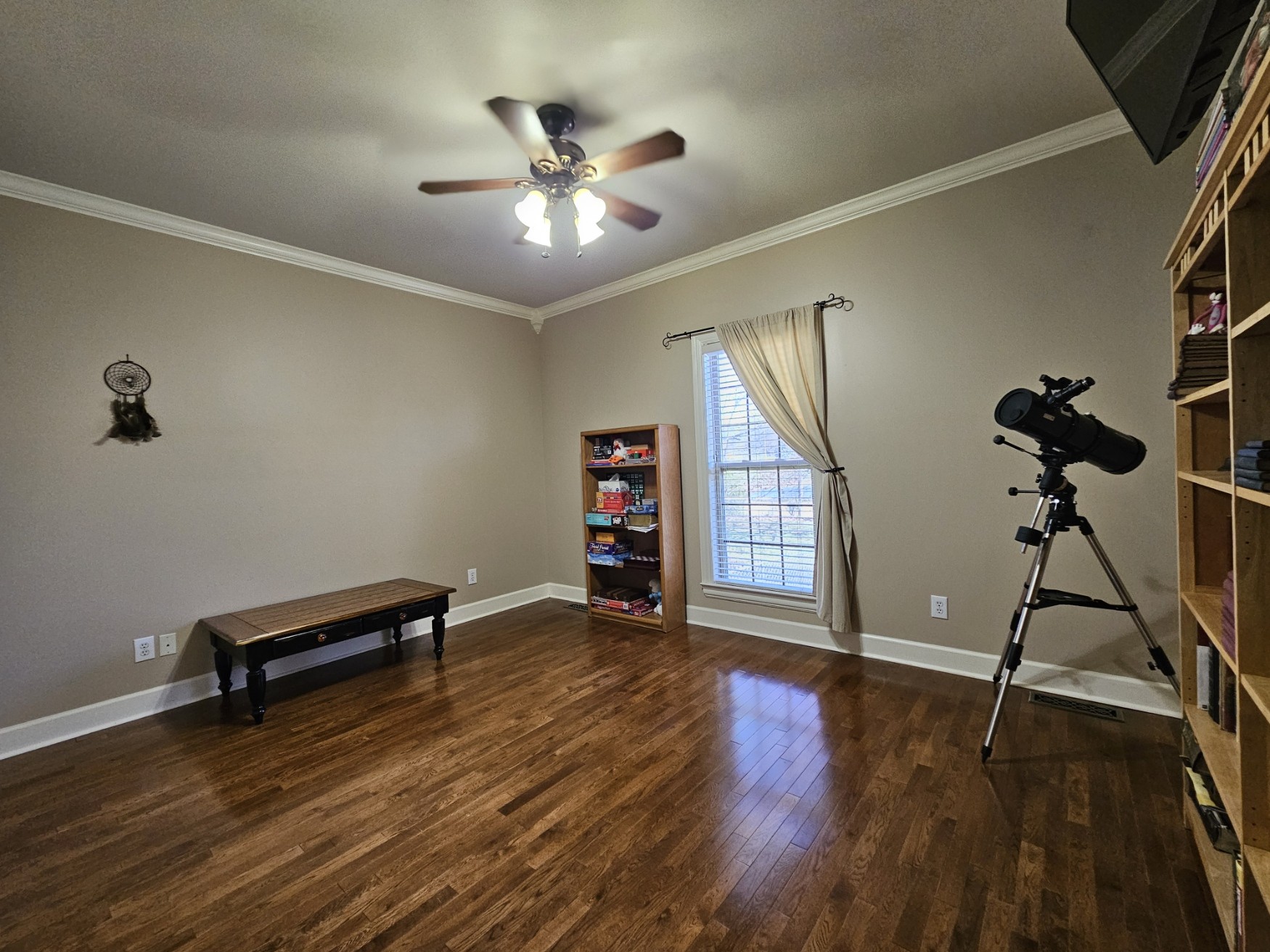 26121 Pheasant Run Ardmore, TN 38449 - Photo 39 of 46 a view of an empty room with a window and wooden floor
