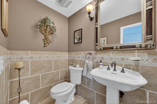 9 Hickory Ridge Road Brewster, NY 10509 - Photo 16 of 50 a bathroom with a sink toilet and a mirror