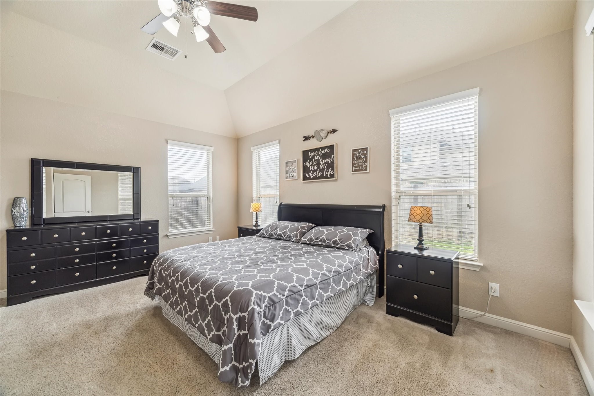 4914 Mountain Maple Trail Rosenberg, TX 77471 - Photo 15 of 24 Spacious primary suite filled with natural light from large windows, offering a peaceful and private retreat.