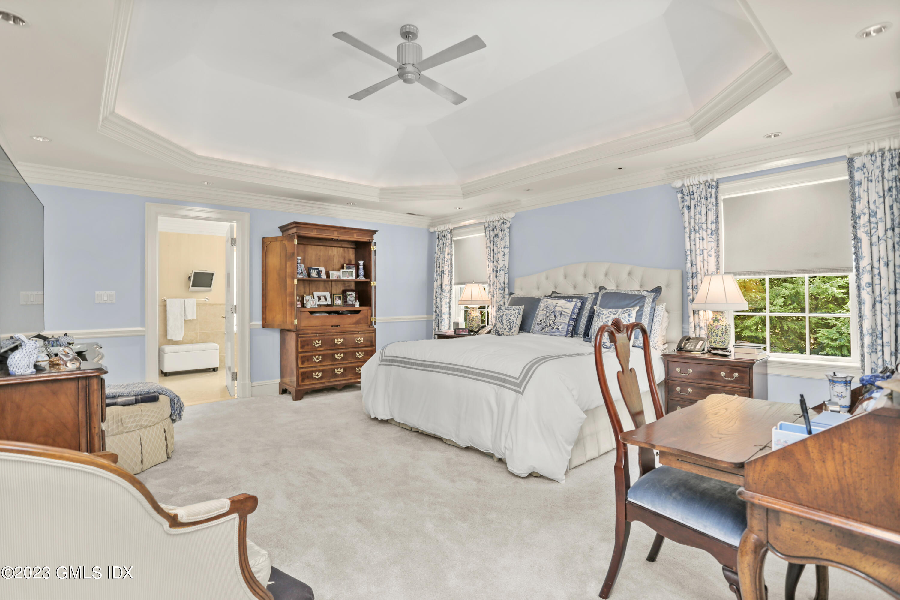 30 Burning Tree Road Greenwich, CT 06830 - Photo 12 of 33 a bedroom with a bed and wooden floor