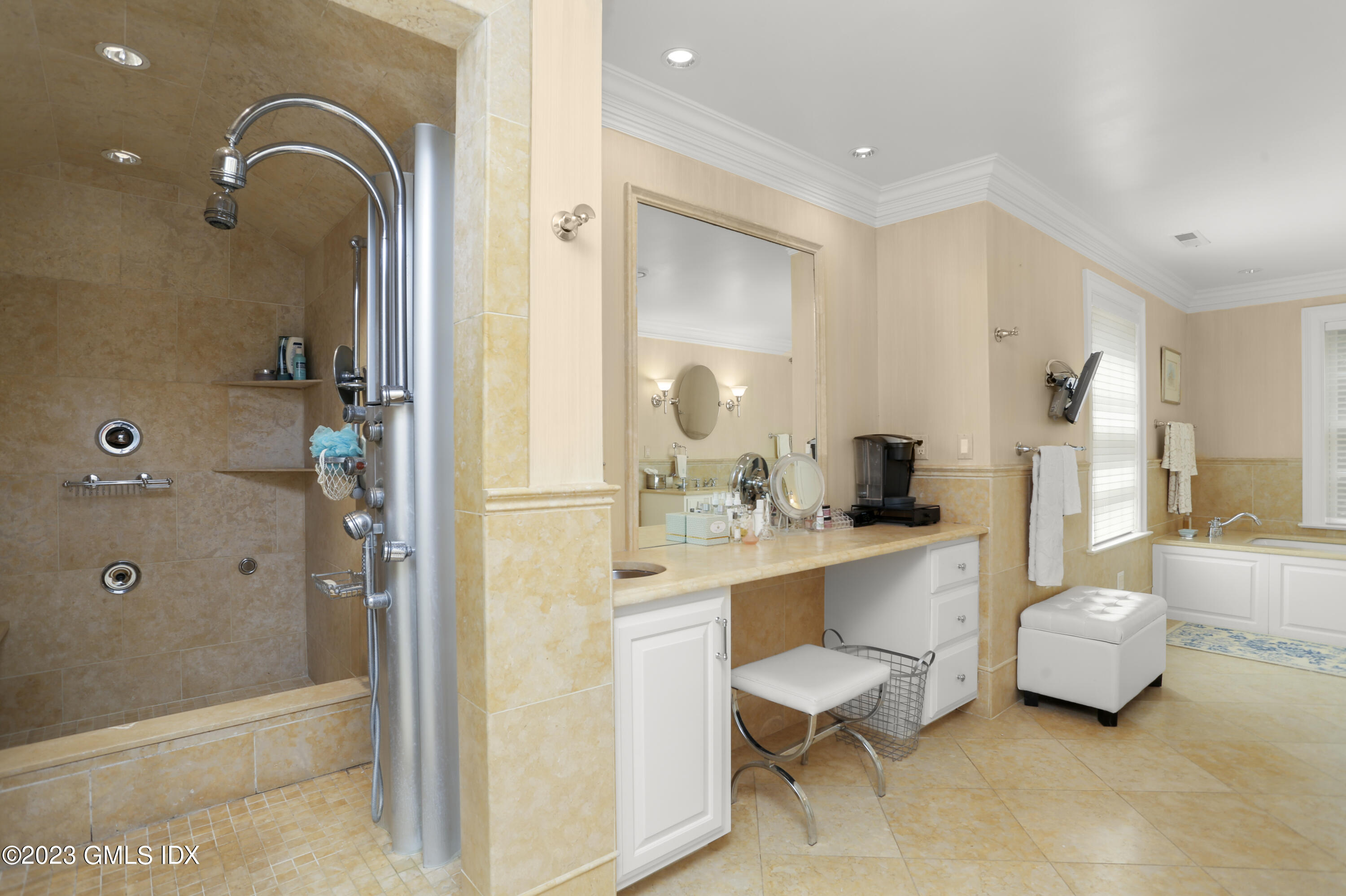 30 Burning Tree Road Greenwich, CT 06830 - Photo 14 of 33 a bathroom with a sink double vanity and tub