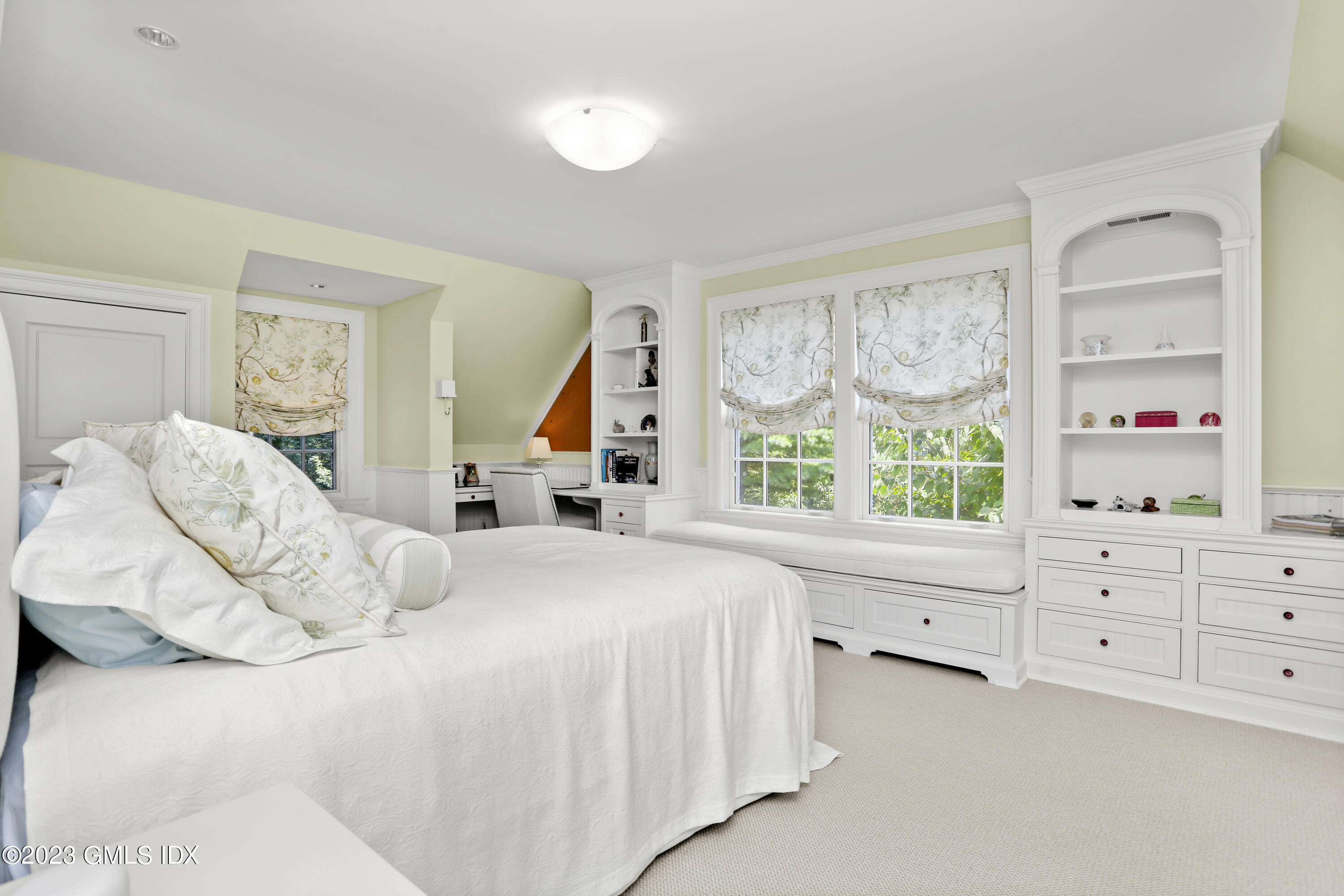 30 Burning Tree Road Greenwich, CT 06830 - Photo 15 of 33 a bedroom with a bed and window