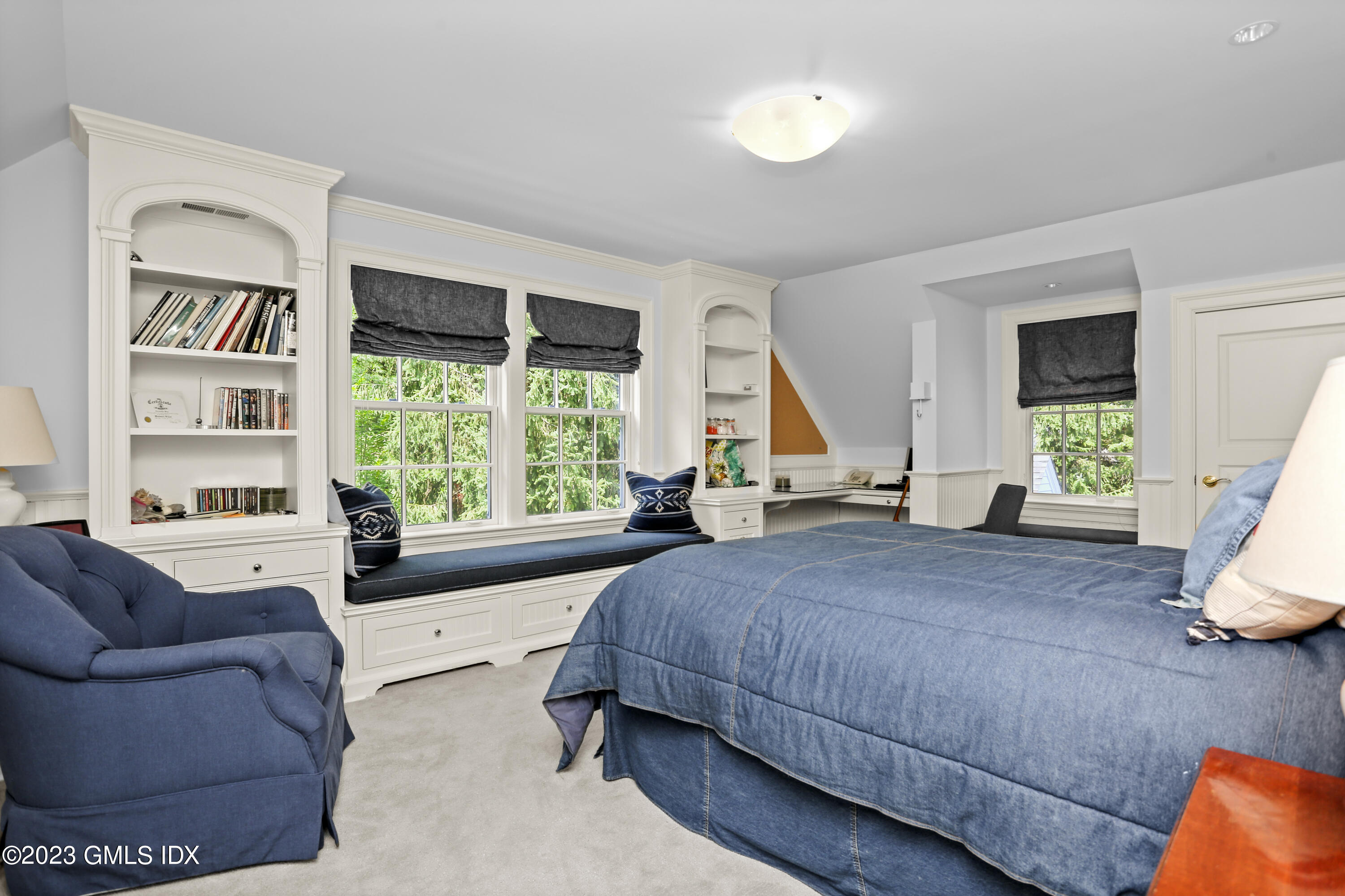 30 Burning Tree Road Greenwich, CT 06830 - Photo 16 of 33 a living room with a bed furniture and a large window