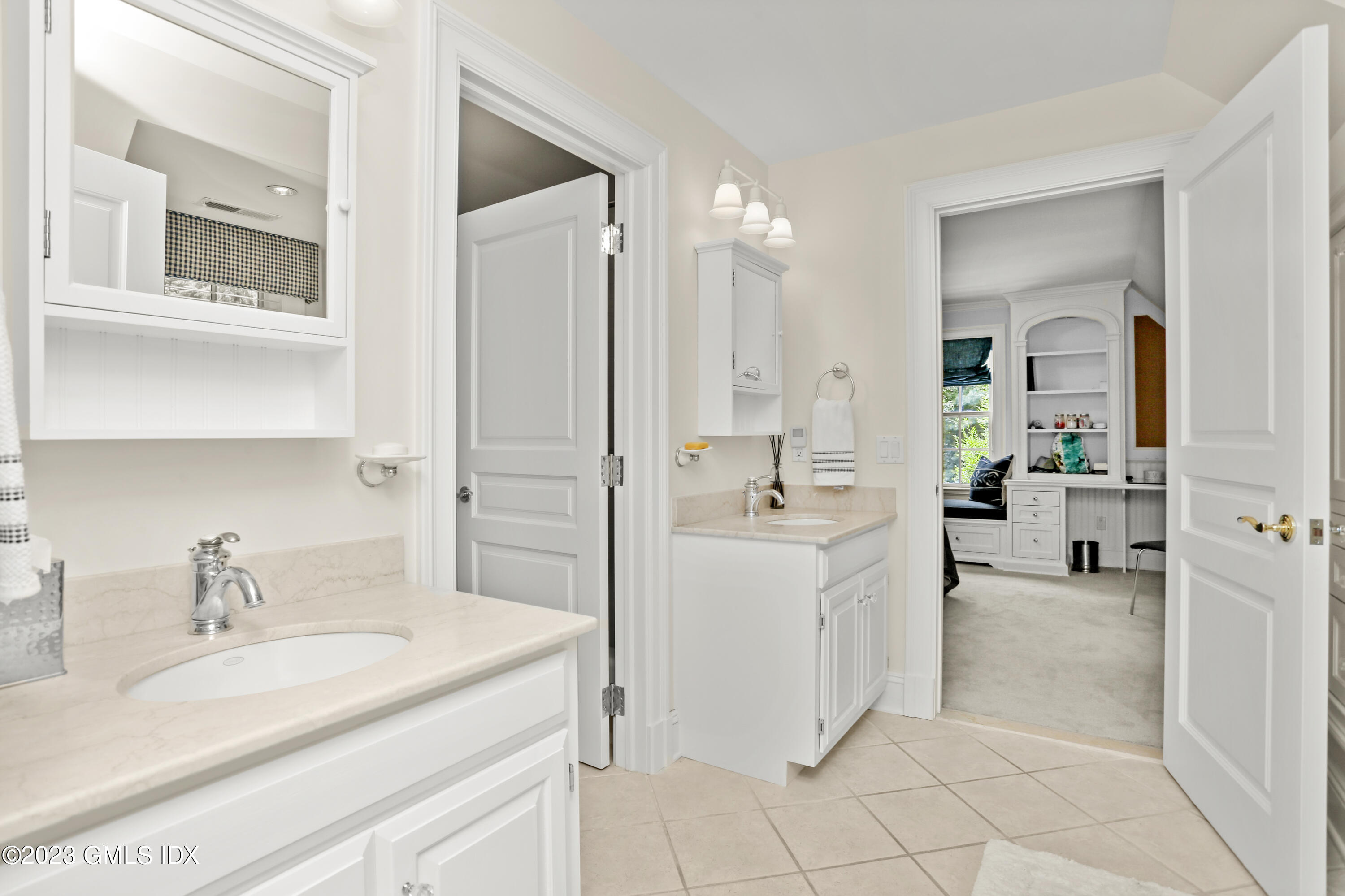 30 Burning Tree Road Greenwich, CT 06830 - Photo 17 of 33 a bathroom with a sink and a mirror