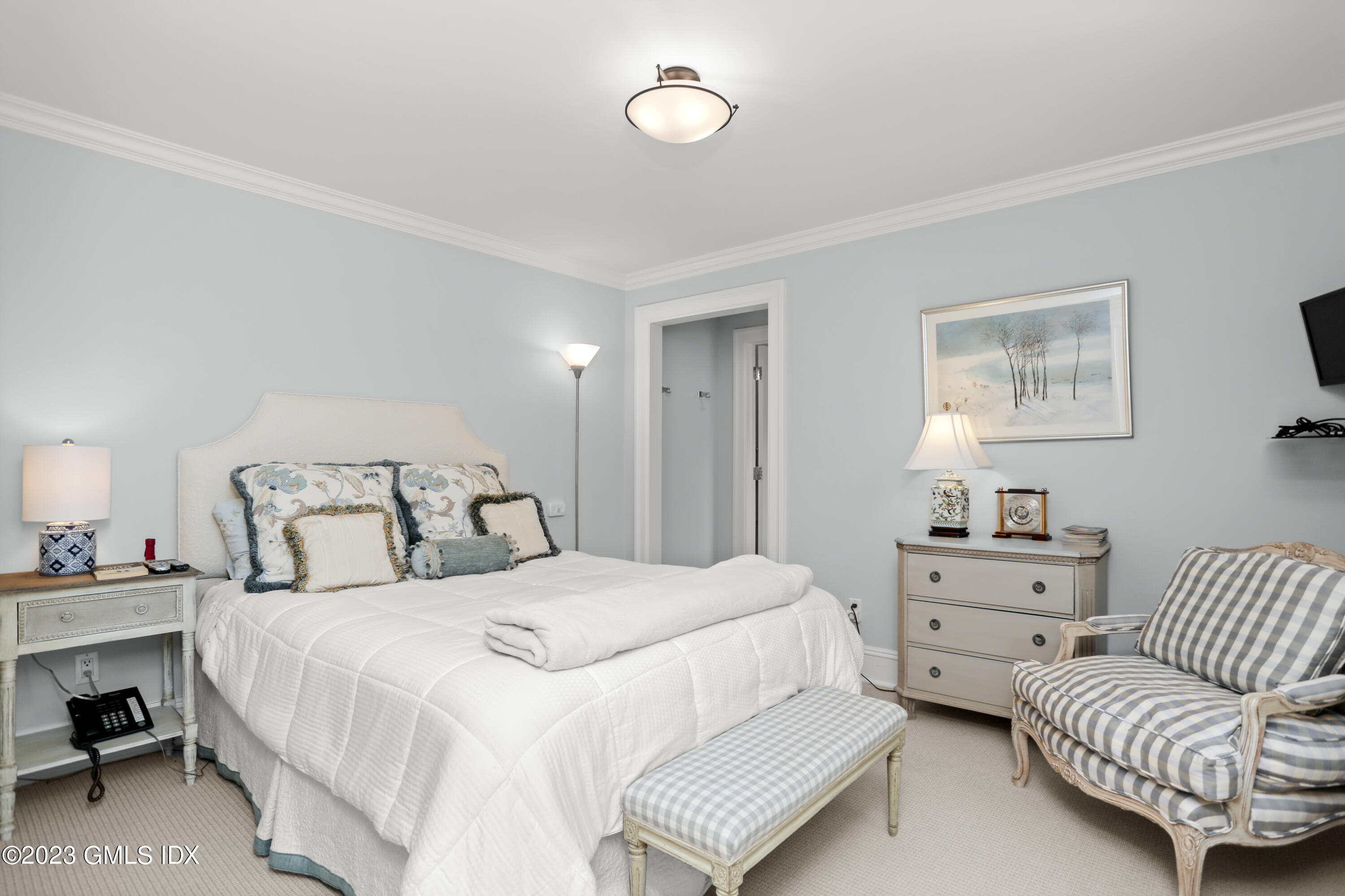 30 Burning Tree Road Greenwich, CT 06830 - Photo 18 of 33 a bedroom with a bed and a couch