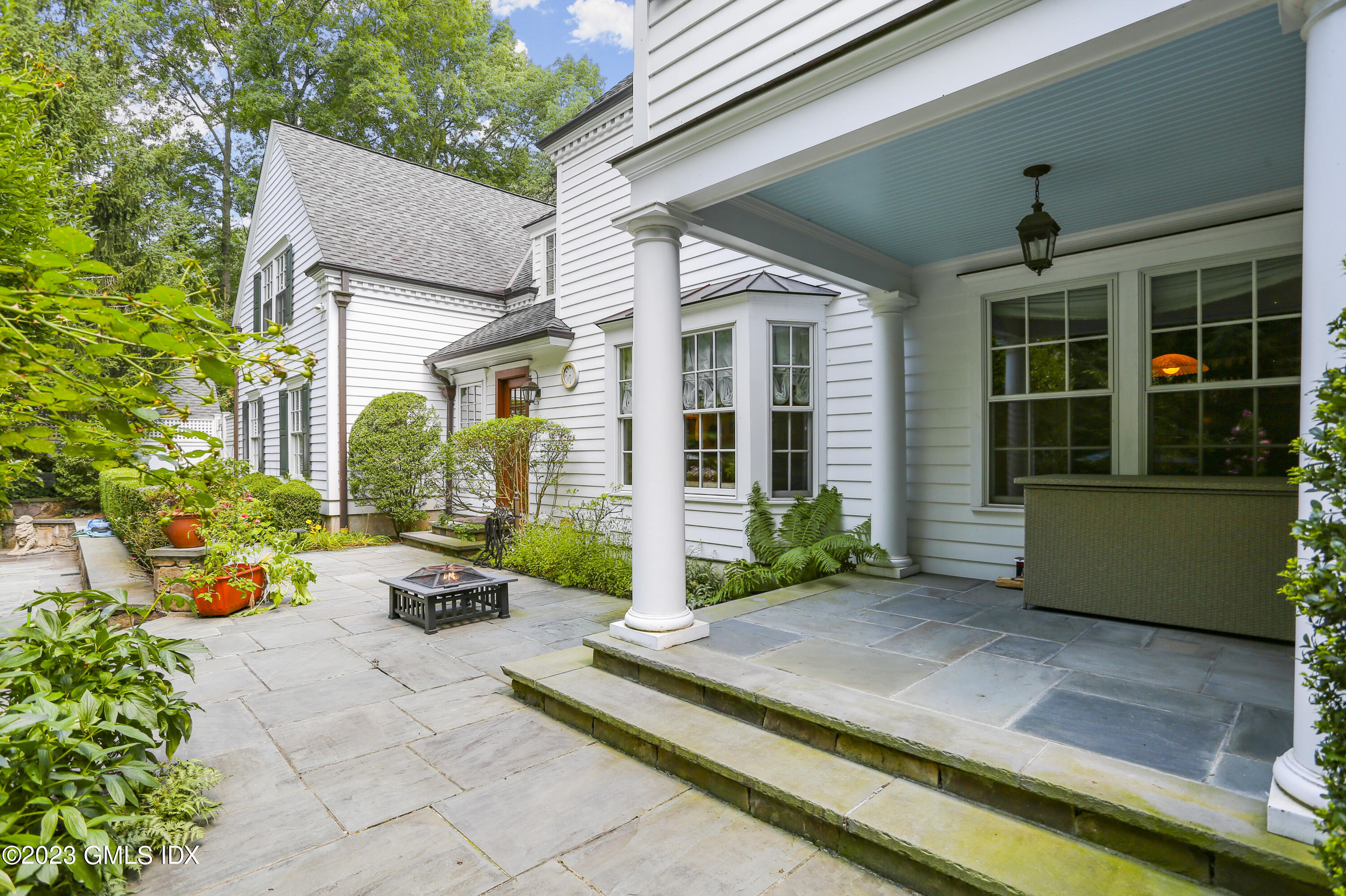 30 Burning Tree Road Greenwich, CT 06830 - Photo 23 of 33 a view of house with outdoor space and porch