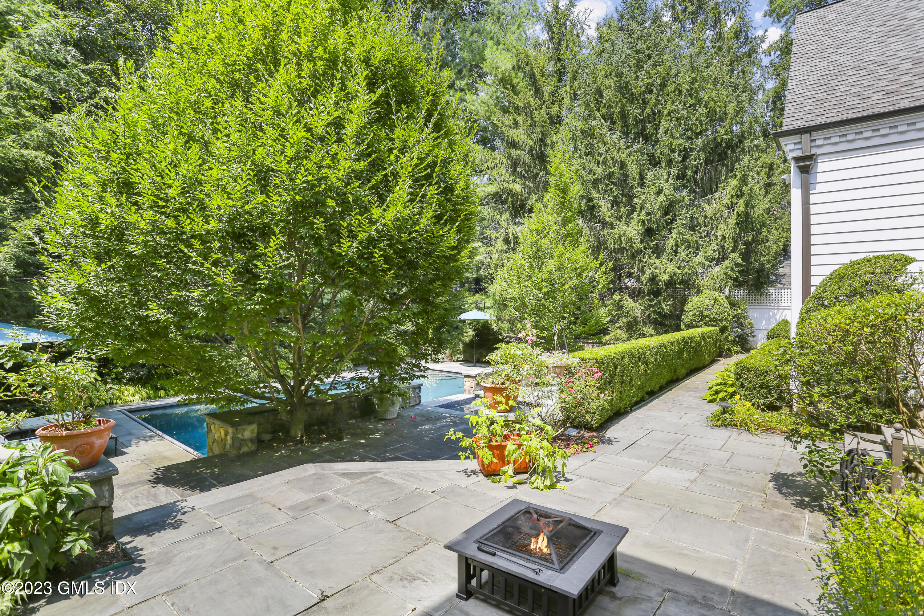 30 Burning Tree Road Greenwich, CT 06830 - Photo 24 of 33 a view of a yard with an outdoor seating