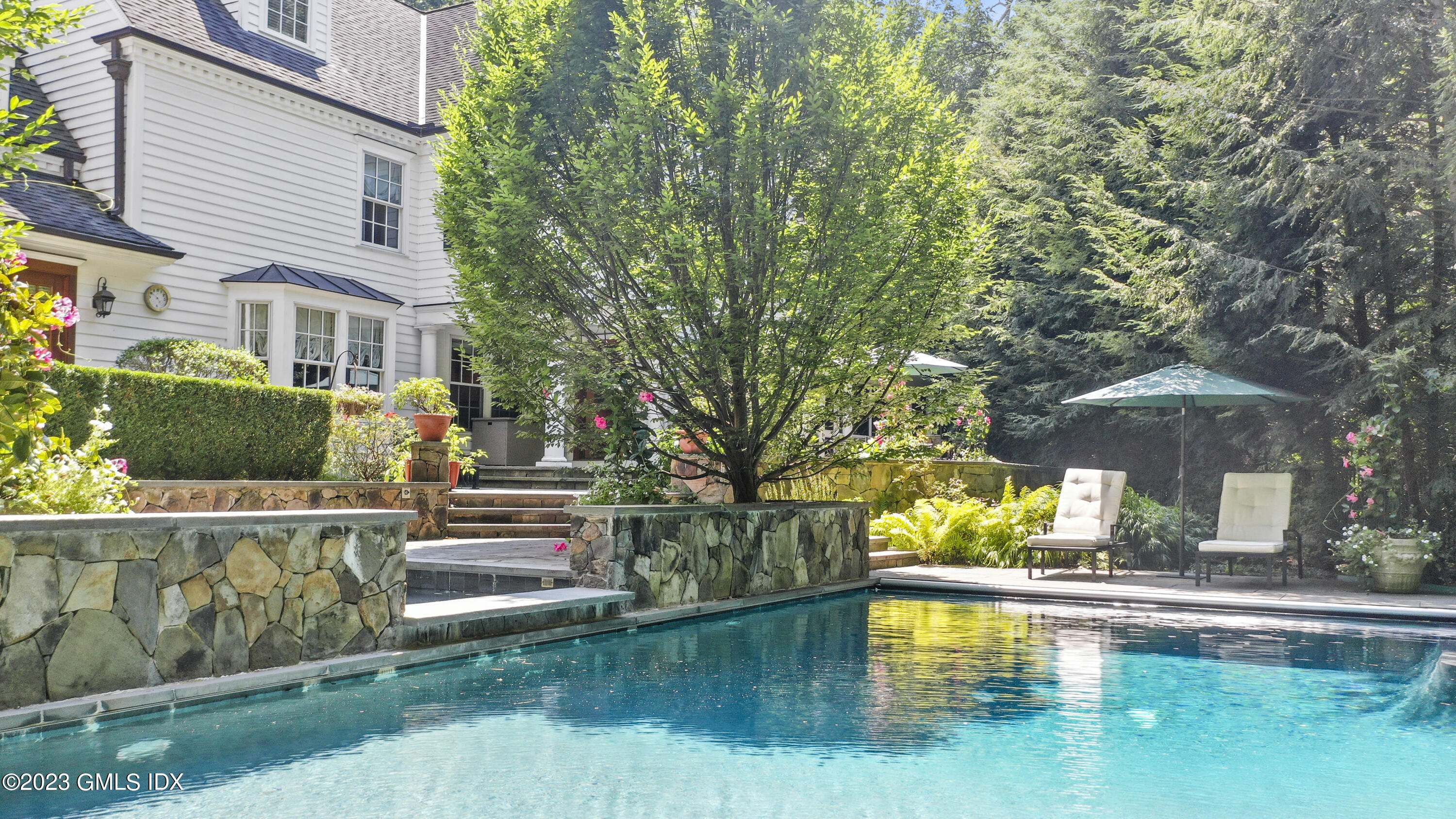 30 Burning Tree Road Greenwich, CT 06830 - Photo 29 of 33 a house with swimming pool