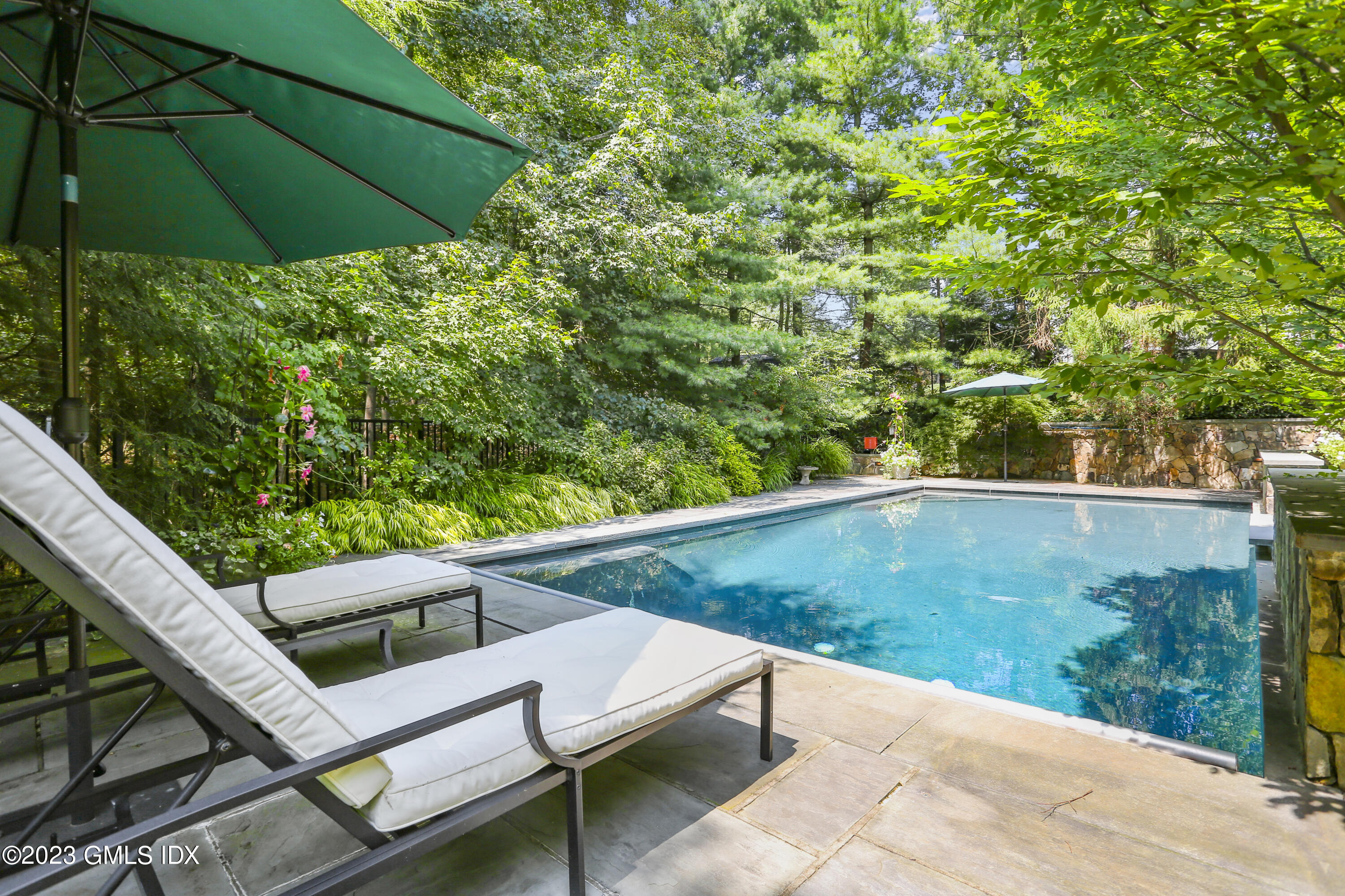 30 Burning Tree Road Greenwich, CT 06830 - Photo 30 of 33 a view of a two chair and table in the patio