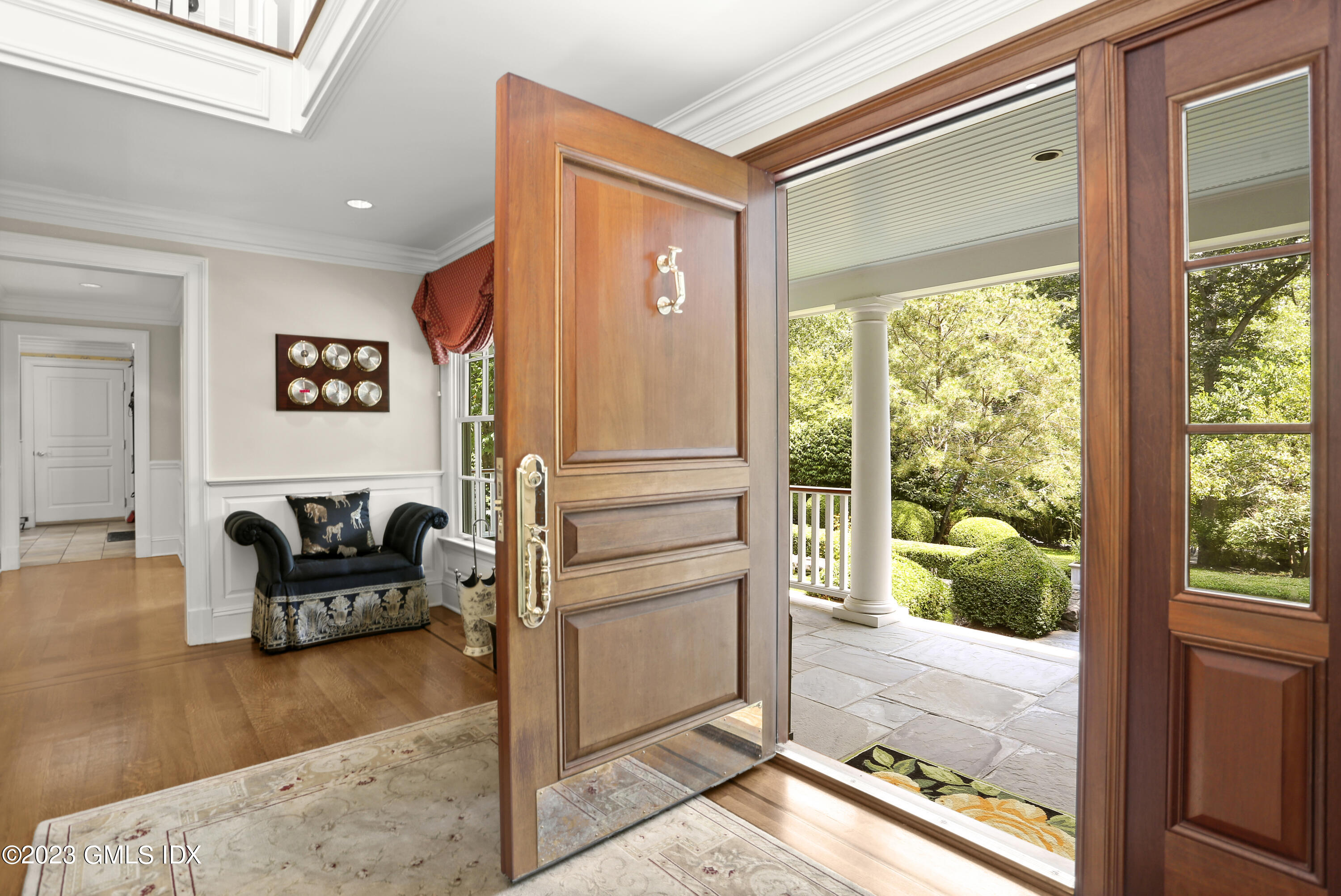 30 Burning Tree Road Greenwich, CT 06830 - Photo 3 of 33 a living room with furniture and a large window