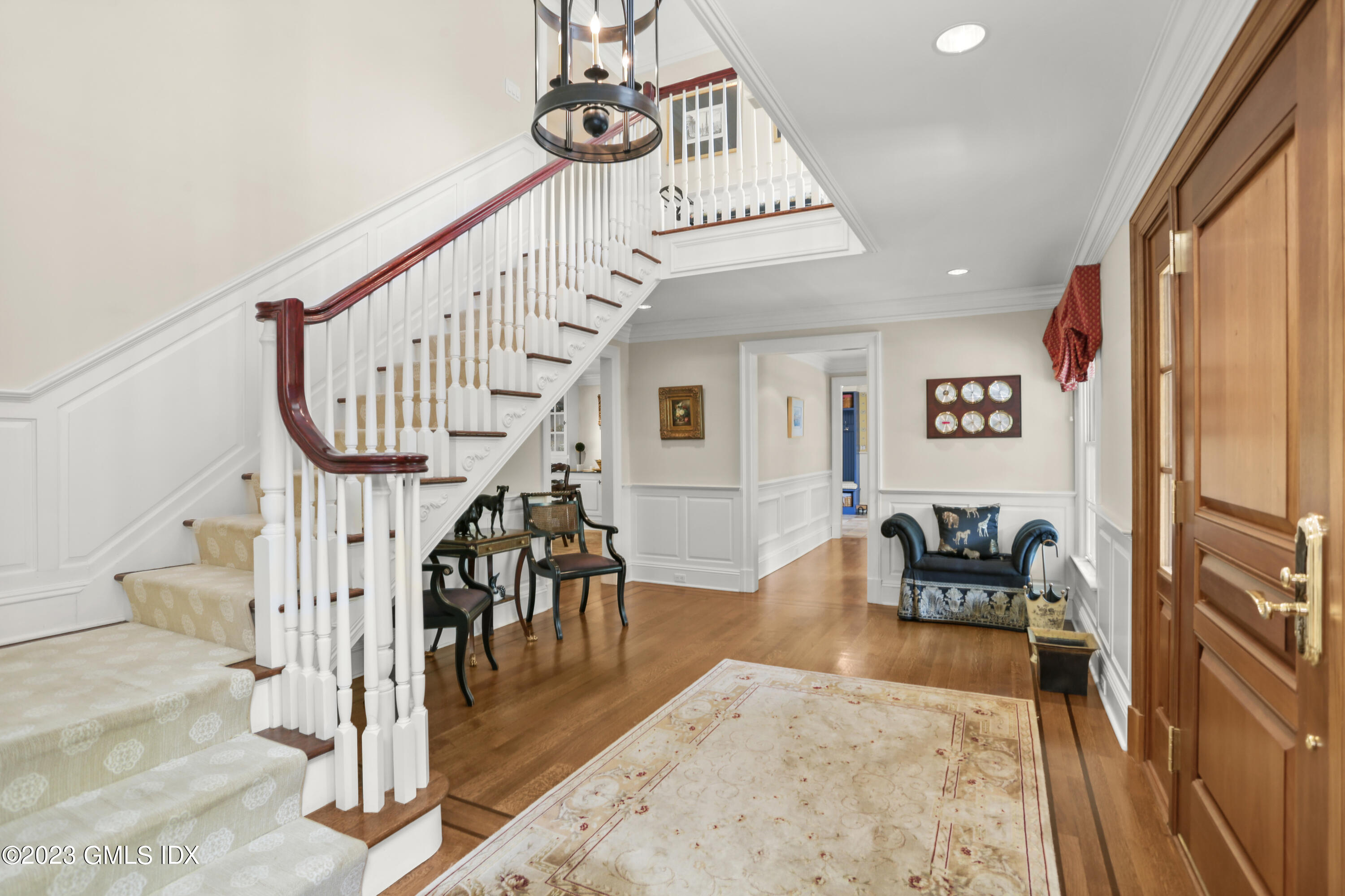 30 Burning Tree Road Greenwich, CT 06830 - Photo 4 of 33 a view of entryway dining room and hall with wooden floor