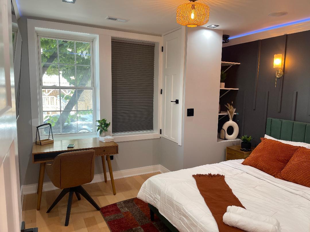 650 North Talman Avenue, Unit 1F Chicago, IL 60612 - Photo 6 of 9 a bedroom with a bed and a window