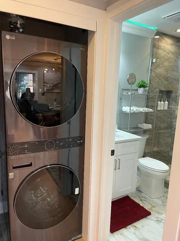 a bathroom with a toilet and a mirror