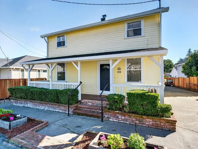 a front view of a house with garage