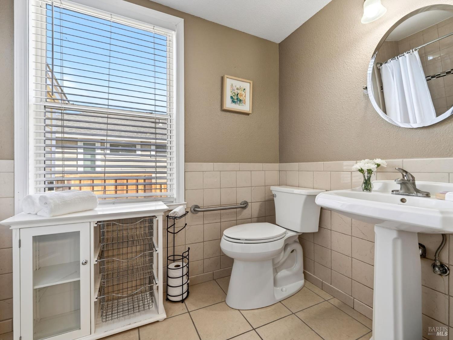 71 Crowell Street Geyserville, CA 95441 - Photo 15 of 42 a bathroom with a toilet sink vanity and mirror