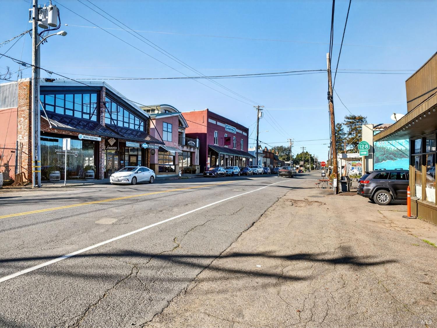 71 Crowell Street Geyserville, CA 95441 - Photo 36 of 42 a city street lined with buildings and cars parked on the roadside
