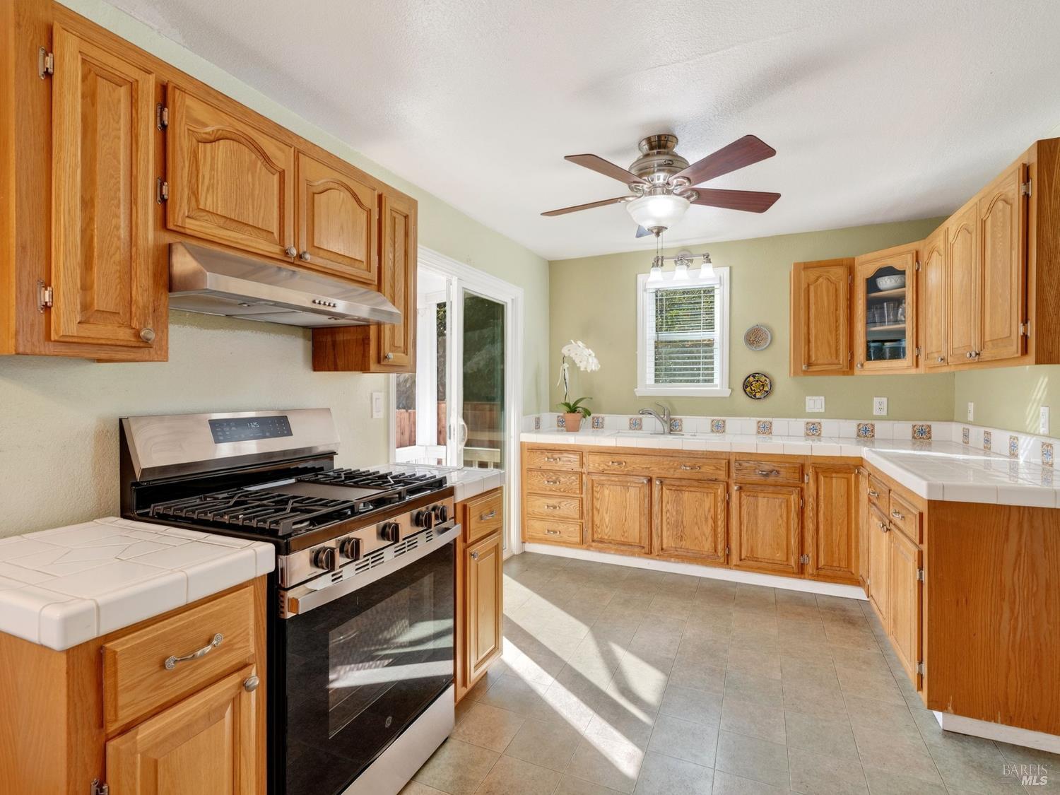 71 Crowell Street Geyserville, CA 95441 - Photo 6 of 42 a kitchen with stainless steel appliances a stove a sink and a microwave