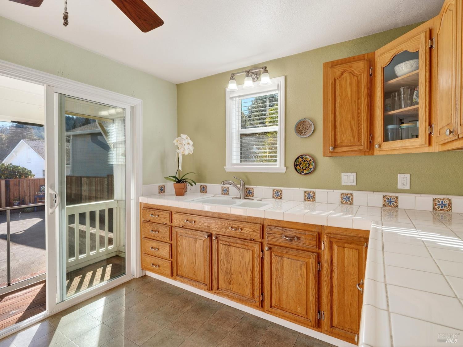 71 Crowell Street Geyserville, CA 95441 - Photo 8 of 42 a bathroom with a granite countertop sink mirror and double