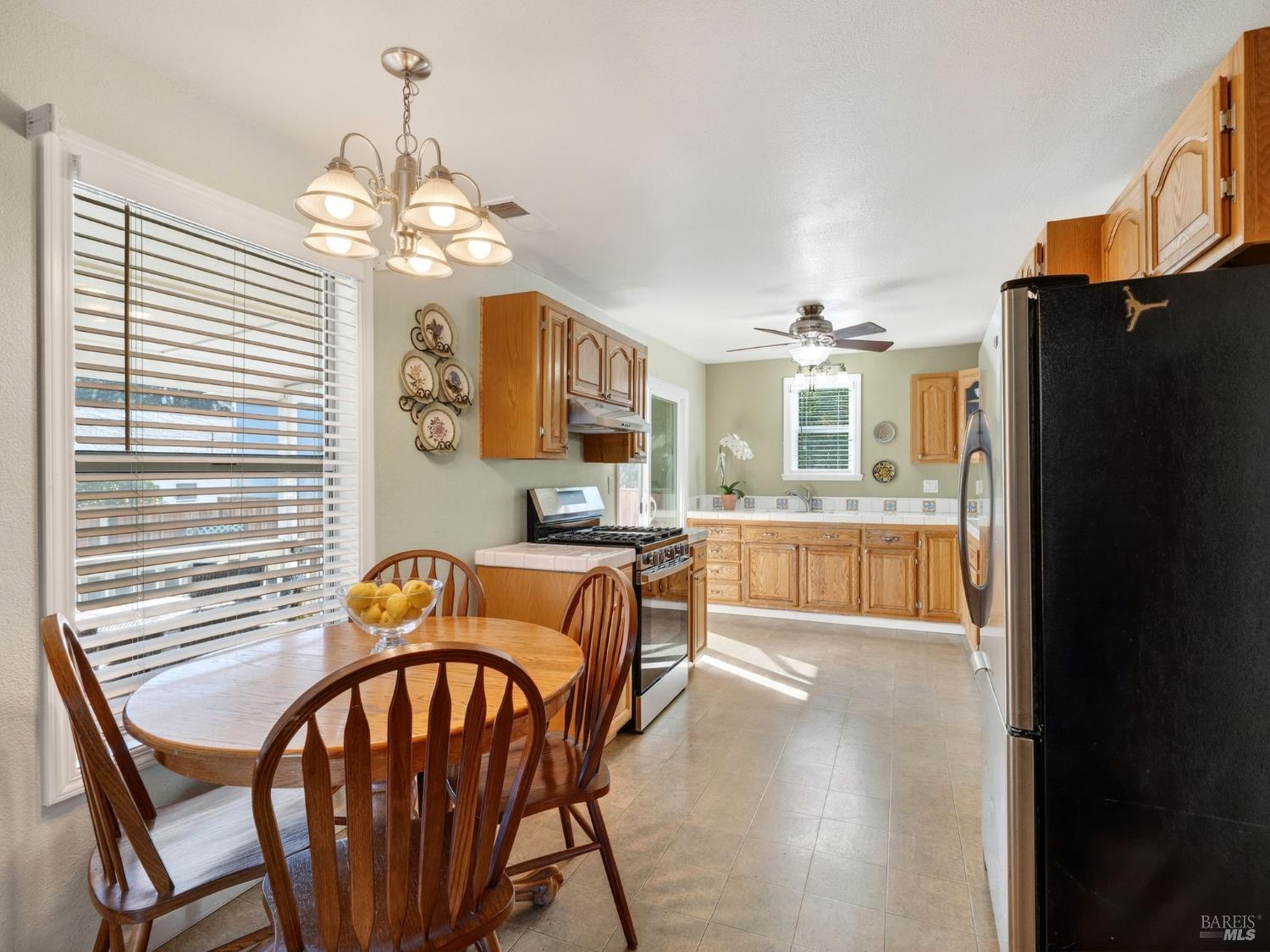 71 Crowell Street Geyserville, CA 95441 - Photo 9 of 42 a view of a dining room with furniture a chandelier and wooden floor