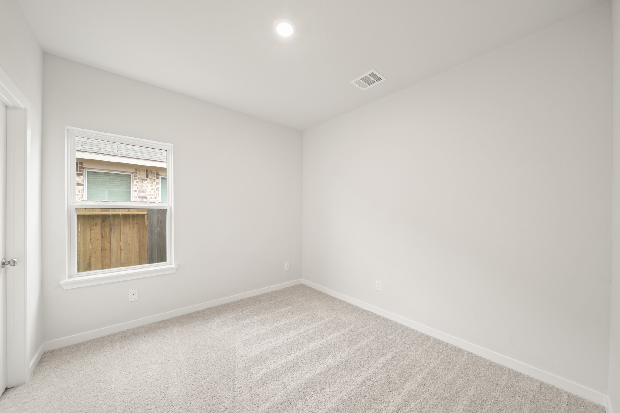 306 Bennett Street Angleton, TX 77515 - Photo 14 of 29 a view of empty room with window
